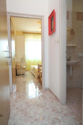 a room with a bathroom with a sink and a toilet at Apartments by the sea Kali, Ugljan - 834 in Kali