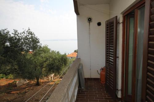 a stairway leading to a house with an open door at Apartments by the sea Kali, Ugljan - 834 in Kali