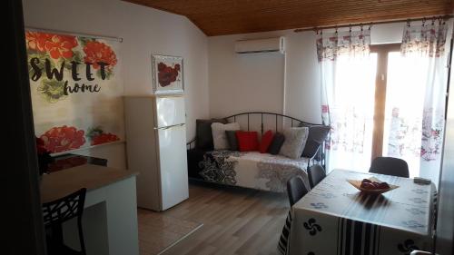 a small living room with a bed and a table at Apartments by the sea Sali, Dugi otok - 890 in Sali