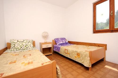 Postel nebo postele na pokoji v ubytování Apartments with WiFi Zman, Dugi otok - 887