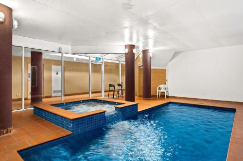 a swimming pool in a hotel room at Warley Retreat in Cowes