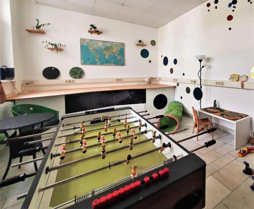 a room with a pool table with balls on it at Waldhotel am See Berlin-Schmöckwitz in Berlin