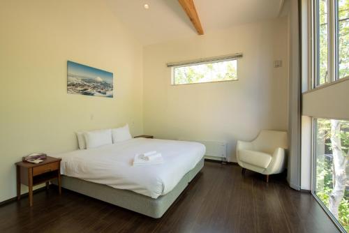 Postel nebo postele na pokoji v ubytování Annupuri Onsen Chalet