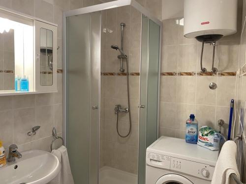a bathroom with a shower and a sink at Apartments by the sea Milna, Brac - 18743 in Milna