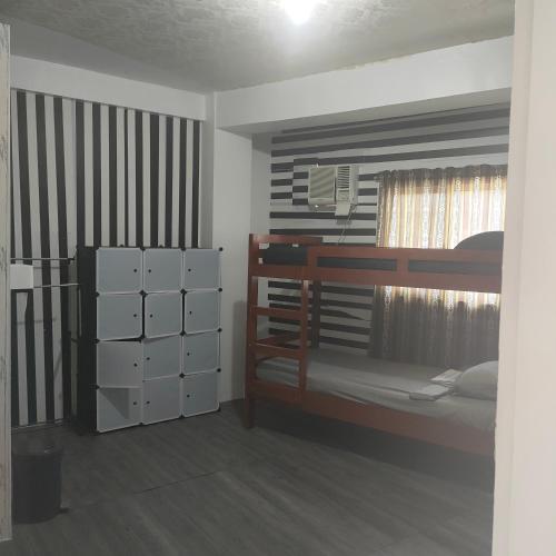 Postel nebo postele na pokoji v ubytování Pier La Casa Homestay Building