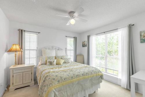 a bedroom with a bed and a ceiling fan at Seaside Sanctuary close to Navarre Beach! in Navarre
