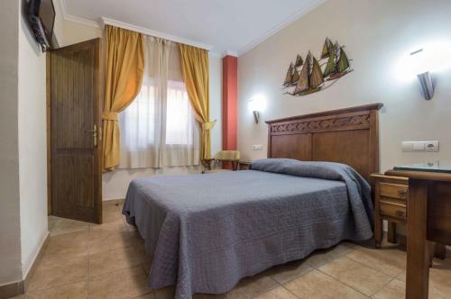 Katil atau katil-katil dalam bilik di Hostal Costa Luz