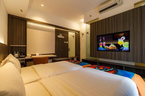 Säng eller sängar i ett rum på Grand Picasso Hotel