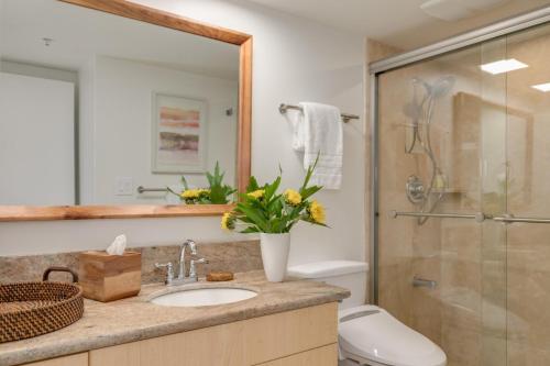 a bathroom with a sink and a shower at Waikiki Sunset #3209 in Honolulu