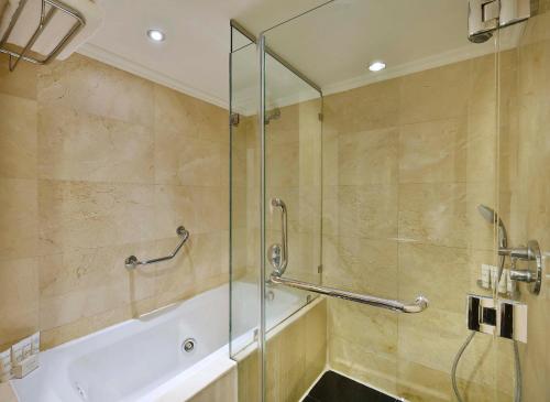 a shower with a glass door in a bathroom at Crowne Plaza Amman by IHG in Amman