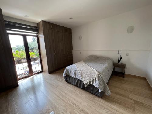 Ένα ή περισσότερα κρεβάτια σε δωμάτιο στο Loft Santiago Val’quirico