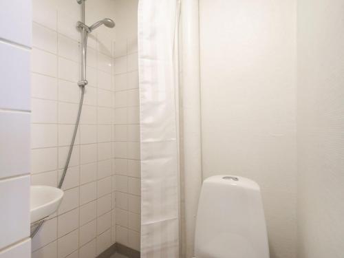 a bathroom with a shower with a toilet and a sink at Sanders Park - One-Bedroom Apartment Near a Huge City Park in Copenhagen