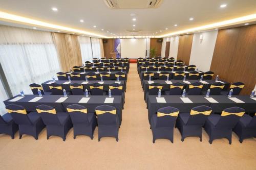 a room with rows of chairs in a hall at Reyna Hotel Hanoi & Spa in Hanoi