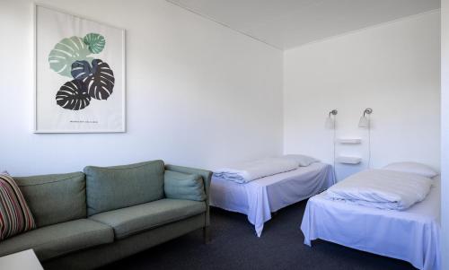 Postel nebo postele na pokoji v ubytování Tylstrup Kro og Motel