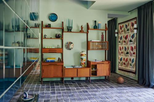 a room with wooden shelves in a room at FERN dom mazurski in Mrągowo