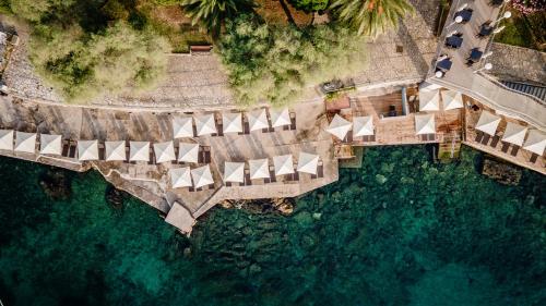 an overhead view of a pool of water with umbrellas at Hotel Kristal - Liburnia in Opatija