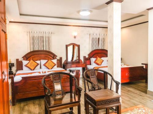 Ένα ή περισσότερα κρεβάτια σε δωμάτιο στο Ananta Hotel Luangprabang