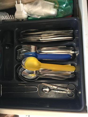 a drawer filled with lots of utensils in a drawer at BED & BREAKFAST 5 MIN FROM e47 - DOGS WELCOME - COSY FARM BnB in Tureby