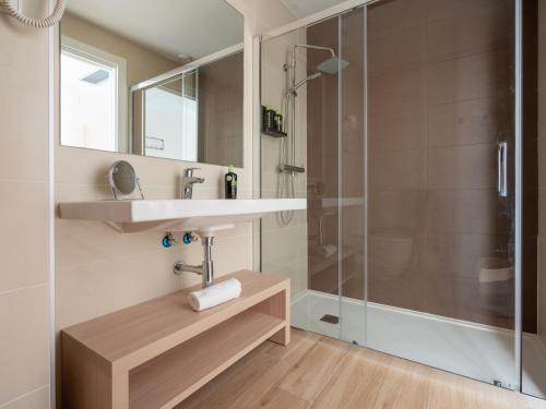 a bathroom with a sink and a shower at limehome Barcelona Carrer de Besalú 82 in Barcelona