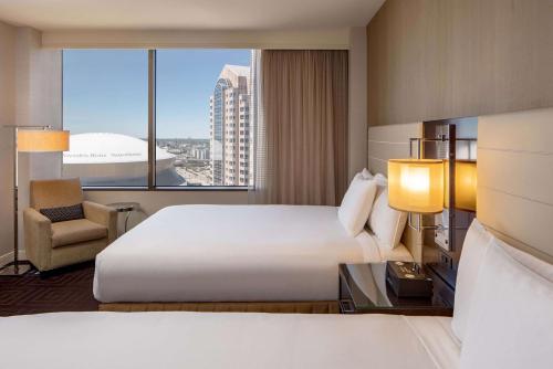 a hotel room with a large bed and a window at Hyatt Regency New Orleans in New Orleans
