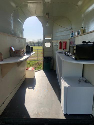 an inside view of a kitchen in an rv at The Warren, Hot Tub in Brackley