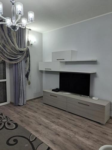 a living room with a flat screen tv on a wall at Welcome home in Terni