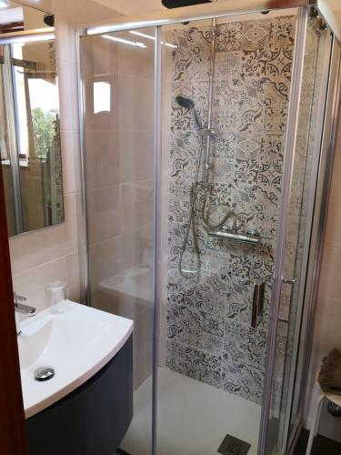a bathroom with a shower and a sink at Da Riccardo in Malfa
