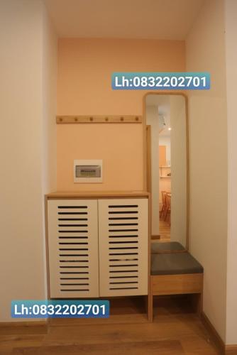 a room with a mirror and a shelf and a mirror at TMS Pullman Căn Hộ Cao Cấp Quy Nhơn in Quy Nhon