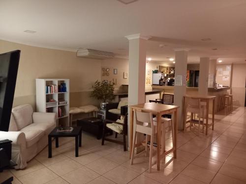 a living room with a couch and a table at Vilamar in Luz