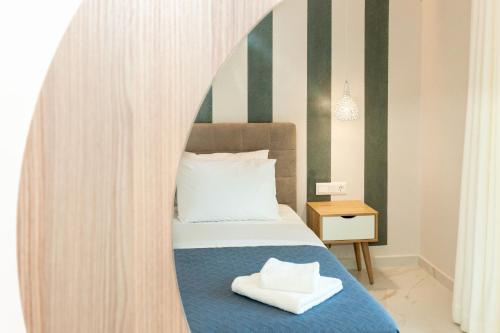 a bedroom with a bed with a large at Mylos Mountain Villas- Villa Giorgio in Agios Nikitas