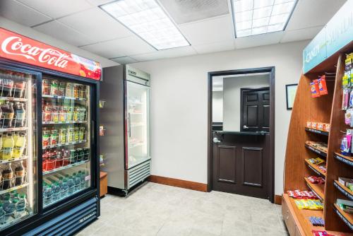 a cocacola store with its refrigerators and drinks at Staybridge Suites Memphis-Poplar Ave East by IHG in Memphis