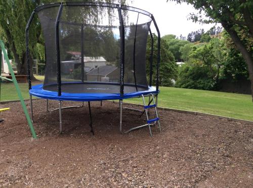 a small trampoline in a park at Alexandra Garden Court Motel in Alexandra