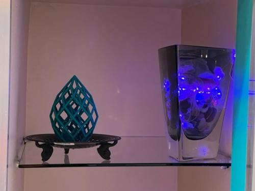 a shelf with two vases and a vase on it at Uber Close to Ohio City, Cleveland (Lower) in Cleveland