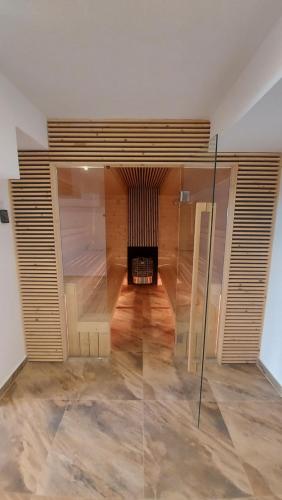 a room with a fireplace in the middle of a room at The Cohen's Guest House in Kyustendil