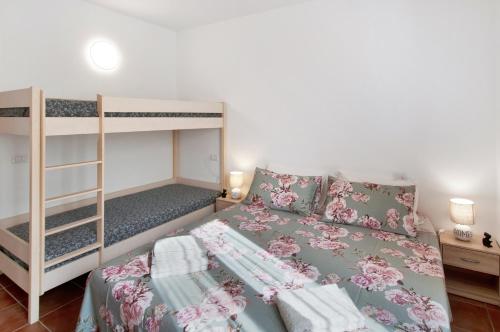 a bedroom with a bunk bed and a bunk bed at Casa Sole in Novate Mezzola