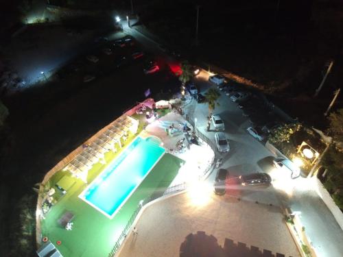 an overhead view of a swimming pool at night at Imperial Park in Raffadali