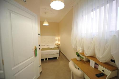 a room with a bedroom with a bed and a window at Villa Zaccardi in Rome