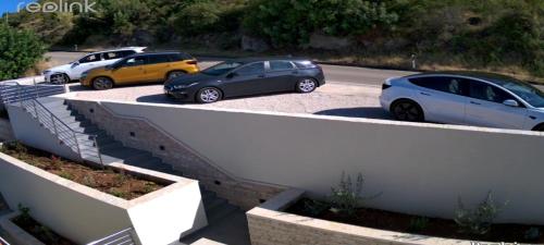 a couple of cars parked in a parking lot at HOLIDAY HOME KATE in Vis