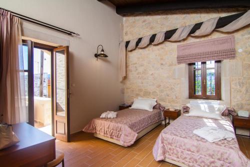 Postel nebo postele na pokoji v ubytování Villa Zefi