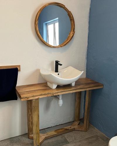 a bathroom with a sink and a mirror at Welbedacht Game & Nature Reserve in Tulbagh
