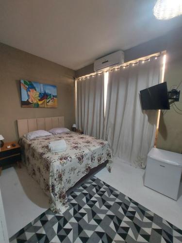 Een bed of bedden in een kamer bij Casa de hospedagem Ferreira - Centro