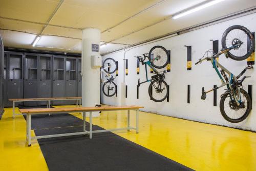 a room with bikes hanging on the wall at Hotel Màgic La Massana by Nexta in La Massana