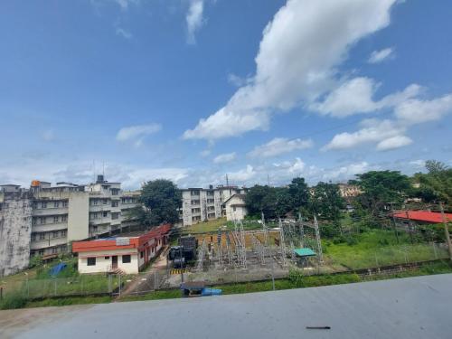 a view of a city with buildings and a playground at FOUR SQUARE COMFORTS in Manipala