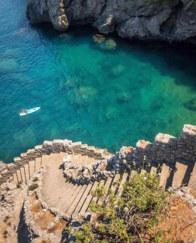 an aerial view of a body of water with a boat at Perla Marina in Trappeto