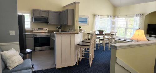 a kitchen and living room with a table and a dining room at My Home in Orlando in Kissimmee