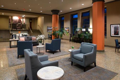 a lobby with couches and chairs and tables at Grand Eastonian Hotel & Suites in Easton