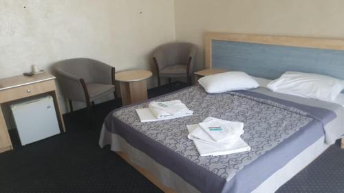 Ein Bett oder Betten in einem Zimmer der Unterkunft Pensiunea Davidof