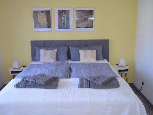 a bedroom with a large bed with towels on it at Ferienwohnung Rieth in Dürbheim