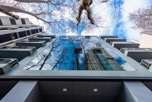 a view from the bottom of a building looking up at the sky at Hotel Bys Palermo in Buenos Aires