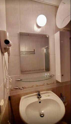 a bathroom with a sink and a mirror at Complex Monastery 1 -Marina Dinevi -Saint Vlas in Sveti Vlas
